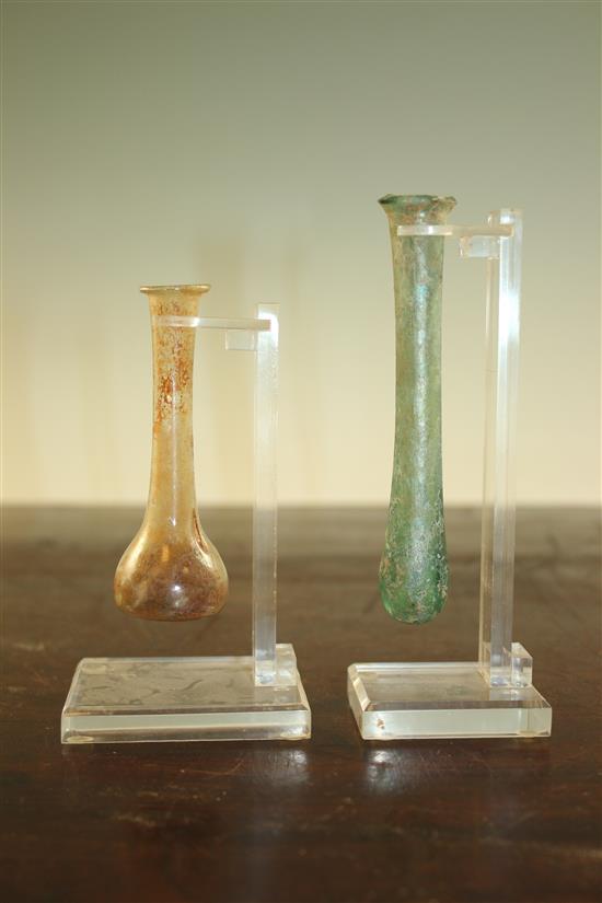 Two Roman glass unguentarium, c.2nd century A.D., 12.5 and 9.5cm